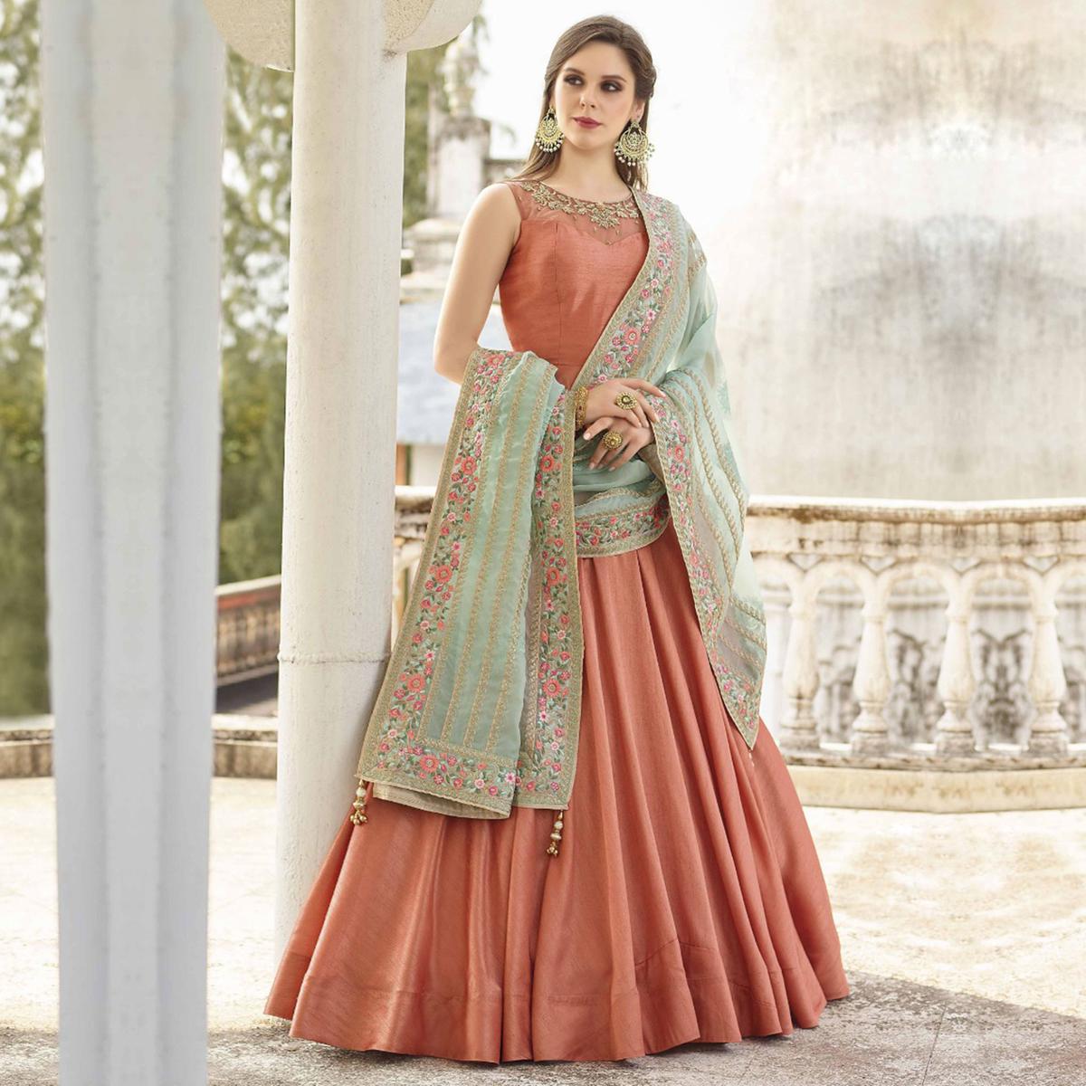 Entrancing Rose Gold Colored Partywear Embroidered Banglori Silk Gown