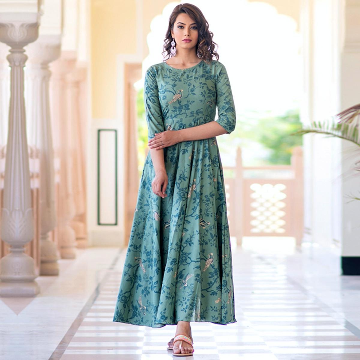 Magnetic Light Aqua Colored Partywear Printed Pure Muslin Long Kurti