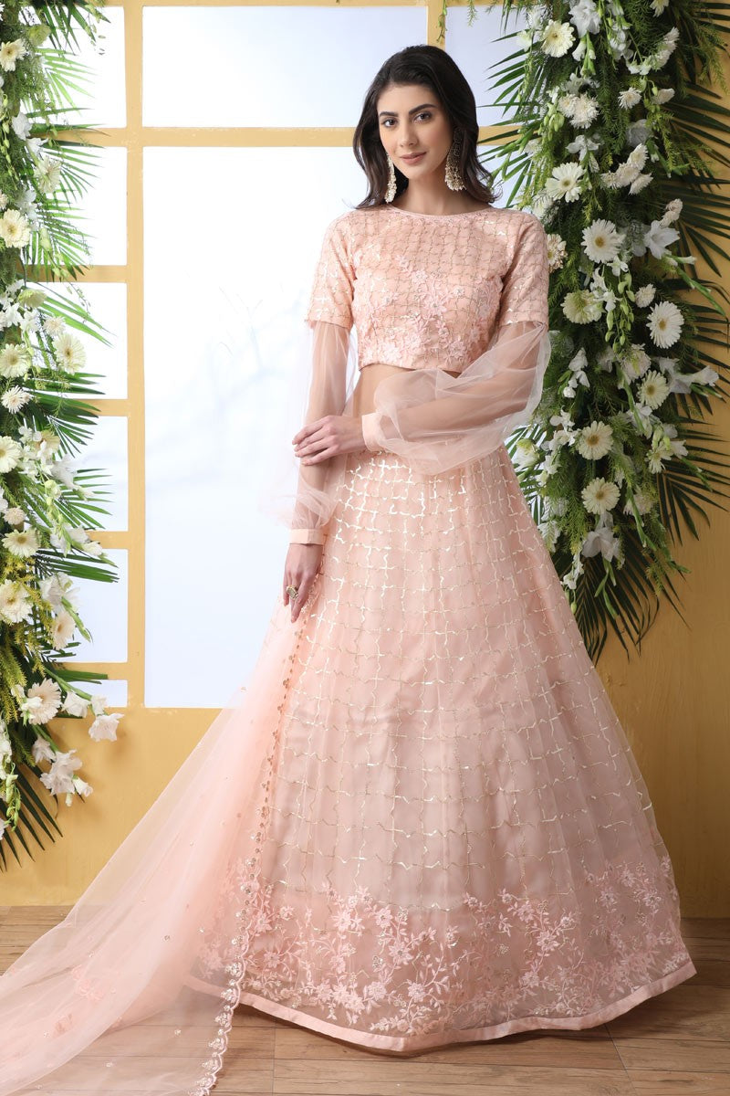 Net Fabric Designer Embroidered Lehenga Choli In Peach Color With Alluring Blouse