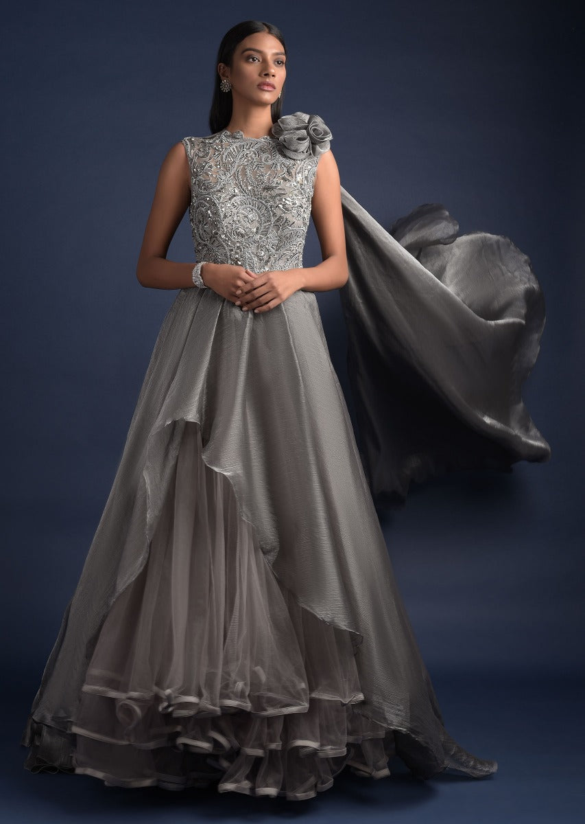 Steel Grey Ball Gown With Shimmer High Low Layer And Attached Drape On The Shoulder